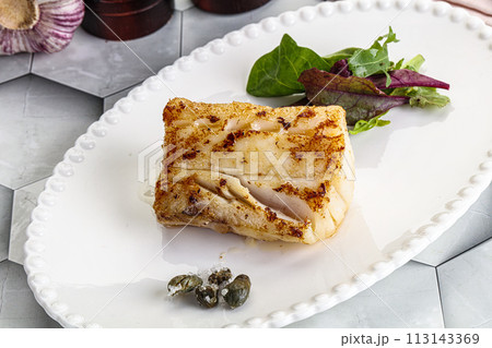 Roasted cod fish steak with salad Roasted cod fish steak with salad 113143369