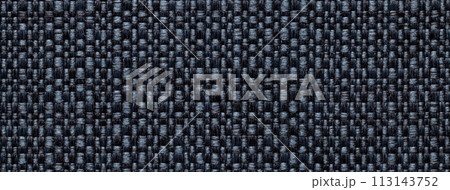 Texture of dark denim color background from woven textile material with wicker pattern, macro. Texture of dark denim color background from woven textile material with wicker pattern, macro. 113143752