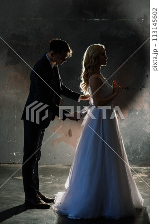 Art fashion studio photo of wedding couple silhouette groom and bride on colors background. 113145602