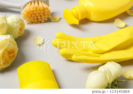 Rubber gloves with flowers, rag and detergents Rubber gloves with flowers, rag and detergents 113145864