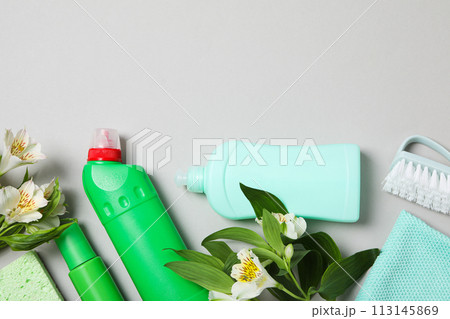 Detergents with fresh flowers on a light background Detergents with fresh flowers on a light background 113145869