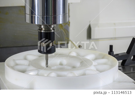 The CNC milling machine cutting the nylon parts with solid ball end mill tool. 113146513