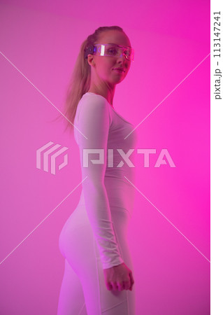 Futuristic Woman in Holographic Glasses with Neon Lights Futuristic Woman in Holographic Glasses with Neon Lights 113147241