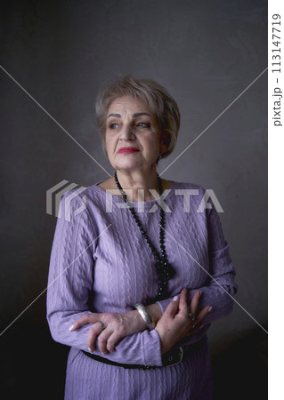 portrait of a beautiful old woman in a purple dress in the style of fine art portrait of a beautiful old woman in a purple dress in the style of fine art 113147719
