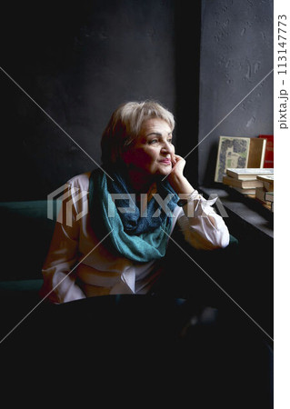 portrait of an old woman in a cafe 113147773