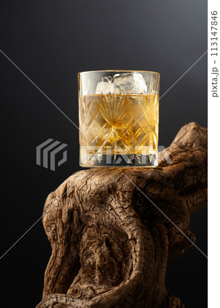 Whiskey with ice in misted glass. Whiskey with ice in misted glass. 113147846