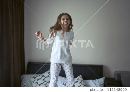 girl jump on a bed girl jump on a bed 113148990