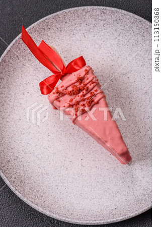 Delicious sweet cheesecake with fruits covered with icing with a wooden stick Delicious sweet cheesecake with fruits covered with icing with a wooden stick 113150868