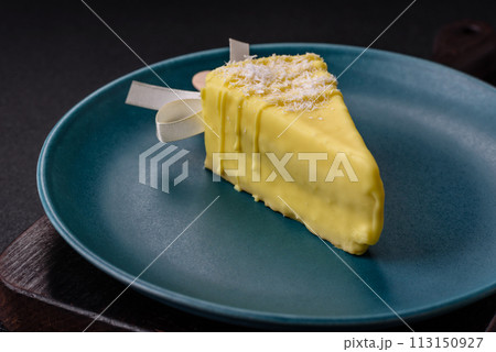 Delicious sweet cheesecake with fruits covered with icing with a wooden stick Delicious sweet cheesecake with fruits covered with icing with a wooden stick 113150927