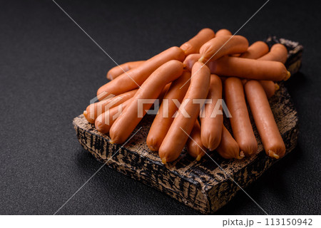 Delicious fresh small vegetarian sausages with salt, spices and herbs Delicious fresh small vegetarian sausages with salt, spices and herbs 113150942