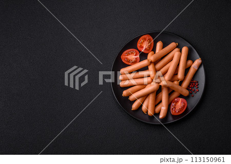 Delicious fresh small vegetarian sausages with salt, spices and herbs 113150961