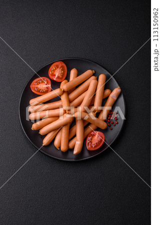 Delicious fresh small vegetarian sausages with salt, spices and herbs 113150962