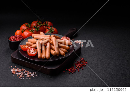 Delicious fresh small vegetarian sausages with salt, spices and herbs 113150963