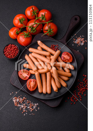Delicious fresh small vegetarian sausages with salt, spices and herbs 113150964