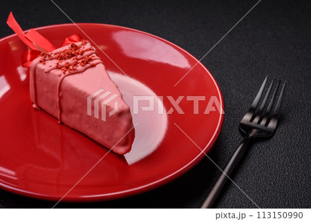 Delicious sweet cheesecake with fruits covered with icing with a wooden stick Delicious sweet cheesecake with fruits covered with icing with a wooden stick 113150990