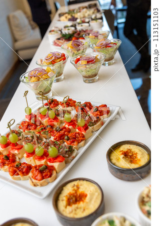 Buffet table with cold appetizers and salads. Buffet table with cold appetizers and salads. 113151103
