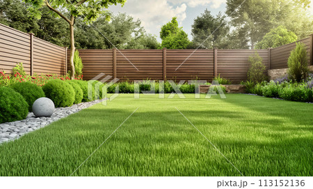 green grass lawn, plants and wooden fence in modern backyard patio 113152136