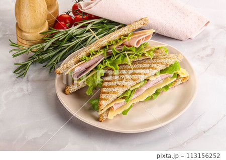 Homemade club sandwich with ham and cheese 113156252
