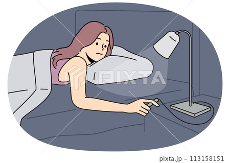 Woman lying in bed turn off lights Woman lying in bed turn off lights 113158151