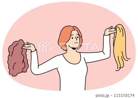 Smiling woman choosing wig Smiling woman choosing wig 113158174