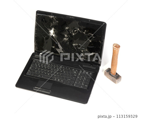 Old broken laptop isolated on white background, broken with hammer Old broken laptop isolated on white background, broken with hammer 113159329
