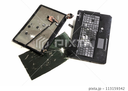 Old broken laptop isolated on white background Old broken laptop isolated on white background 113159342