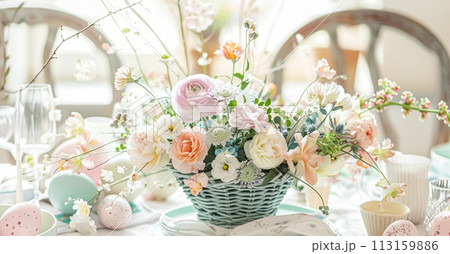 Easter table setting with painted eggs, spring flowers and crockery 113159886