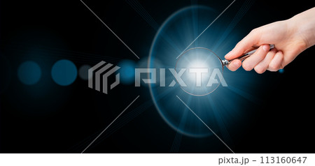 Magnifying glass in hand, light, insight. Banner background Magnifying glass in hand, light, insight. Banner background 113160647