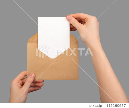Postcard mockup, vertical blank card taking from paper envelope isolated on white Postcard mockup, vertical blank card taking from paper envelope isolated on white 113160657