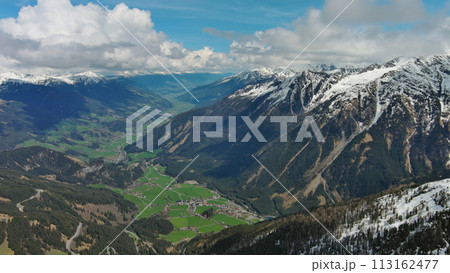 Village in valley and mountain in Alps 113162477