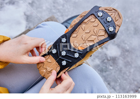 Stainless steel spikes for traction on ice and snow in form of rubber overlay for boots. Stainless steel spikes for traction on ice and snow in form of rubber overlay for boots. 113163999