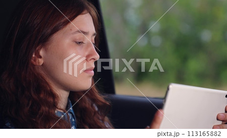 girl tablet car face smile window, travel education technology, studying while traveling, vacation relaxation ride, online study session, window gazing travel, dreamy road education, backseat car ride girl tablet car face smile window, travel education technology, studying while traveling, vacation relaxation ride, online study session, window gazing travel, dreamy road education, backseat car ride 113165882