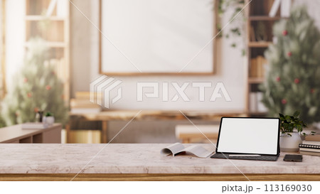 A digital tablet mockup on a white marble table in a minimalist neutral wood living room. 113169030