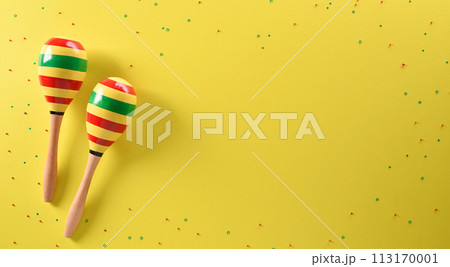 Cinco de Mayo holiday background made from maracas stars on yellow background. Cinco de Mayo holiday background made from maracas stars on yellow background. 113170001