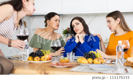 Group of female friends calming woman 113170155