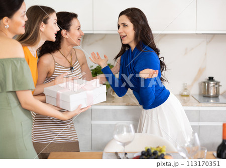 Happy women greeting each other before starting house party 113170351