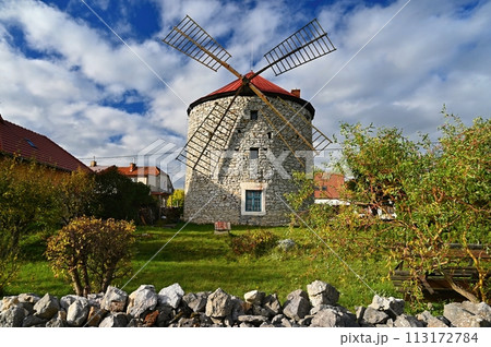 Beautiful old windmill and landscape with the sun. Ostrov u Macochy, Czech Republic. Europe. 113172784