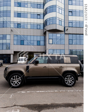 Land Rover Defender in the city street. 113172915