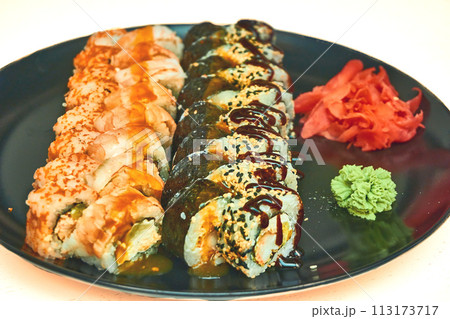 Fresh delicious sushi set with red fish delivered to home, office Fresh delicious sushi set with red fish delivered to home, office 113173717