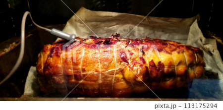Succulent roasted pork loin on baking tray 113175294