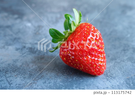 Macro shot of a luscious strawberry, with its vivid red surface and seed-speckled texture 113175742