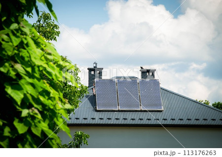 Installing a Solar Cell on a Roof. 113176263