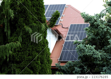 Installing a Solar Cell on a Roof. 113176285