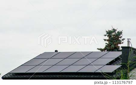 Historic farm house with modern solar panels on roof and wall Historic farm house with modern solar panels on roof and wall 113176797