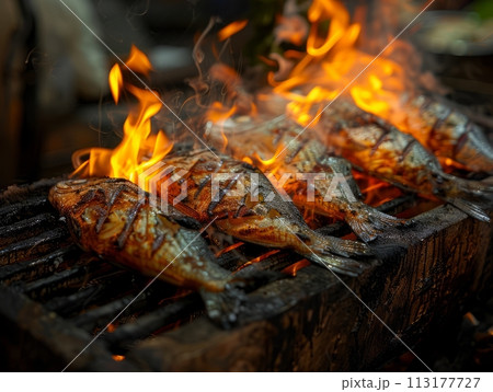 Fish cooking on a grill, macro shoot Fish cooking on a grill, macro shoot 113177727