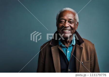 Closeup side view of a senior African American man with earrings against red background 113179776