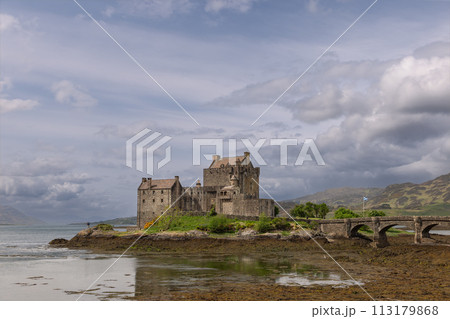 Eilean Donan Castle, reflecting its history in the calm loch is framed by bridge Scottish Highlands Eilean Donan Castle, reflecting its history in the calm loch is framed by bridge Scottish Highlands 113179868