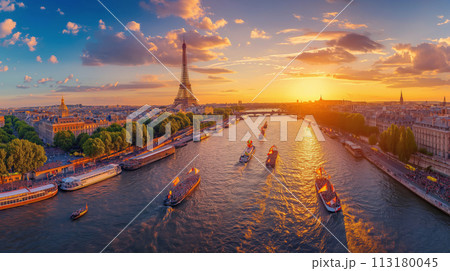 Aerial view on Paris, sunset view of the Eiffel Tower, river, crowded promenades, and tour boats in Paris. Olympic Games in Paris 2024 113180045