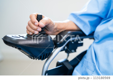 Asian senior woman patient on electric wheelchair with remote control at hospital, healthy strong medical concept. Asian senior woman patient on electric wheelchair with remote control at hospital, healthy strong medical concept. 113180569