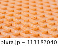 Spelt waffle with a grid pattern, macro closeup perspective view 113182040